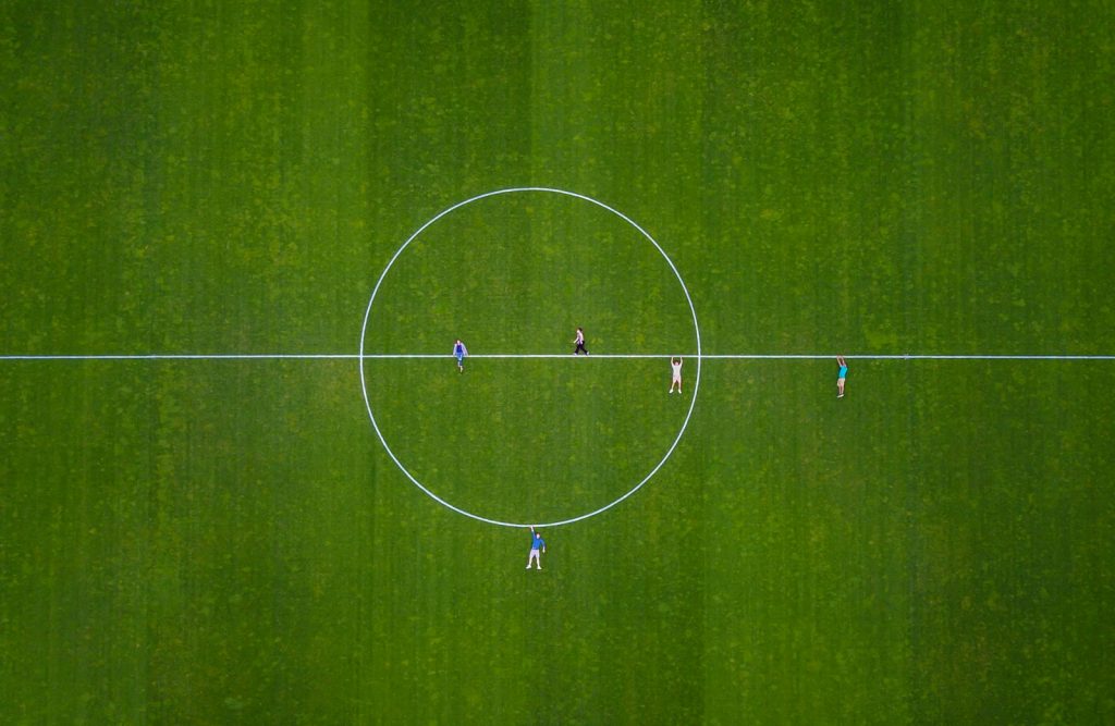 a group of people playing football