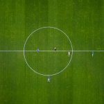 a group of people playing football